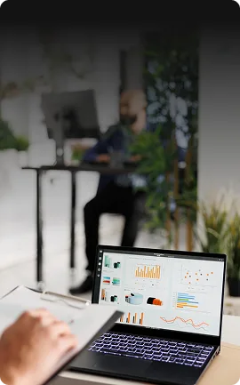 Laptop showing website design and SEO analytics dashboard